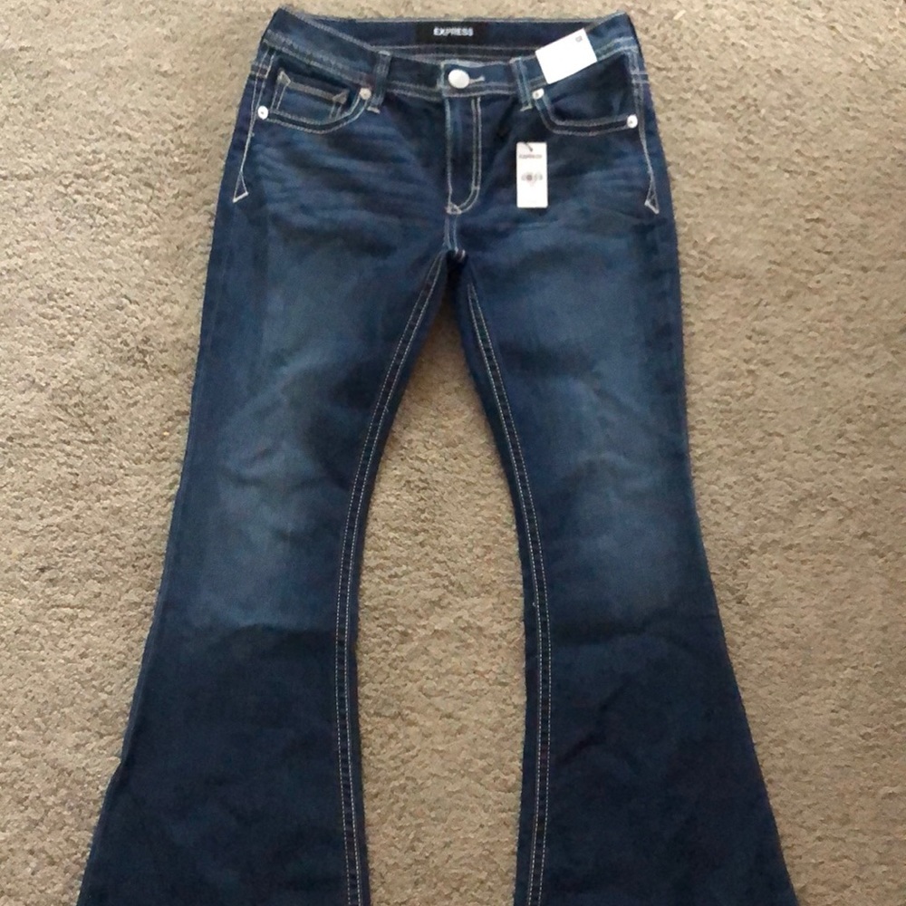 Express women’s mid rise bell flare jeans.